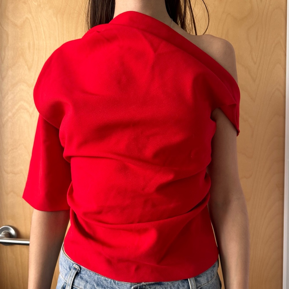 Red asymmetric Zara top dropping from one shoulder with draped design